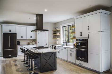 stainless steel appliances with walnut cabinets|black and white kitchen cabinets.